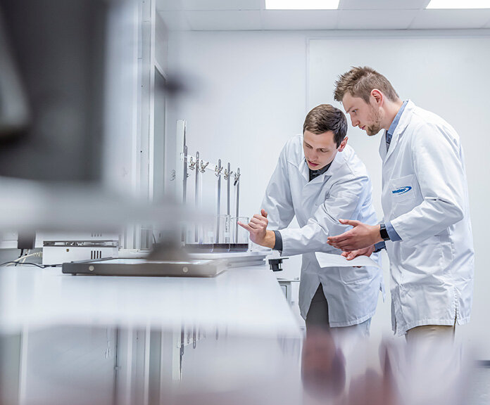  Two employees in the production of thermoplastic composites | Sandler Group 