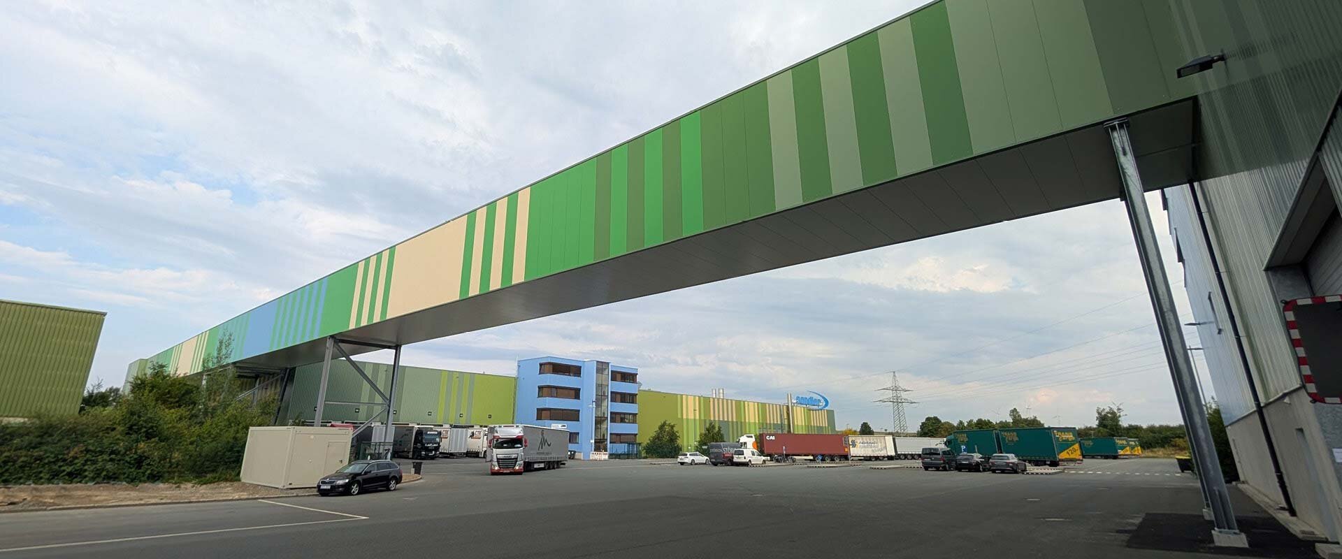 A striped bridge crossing over a street