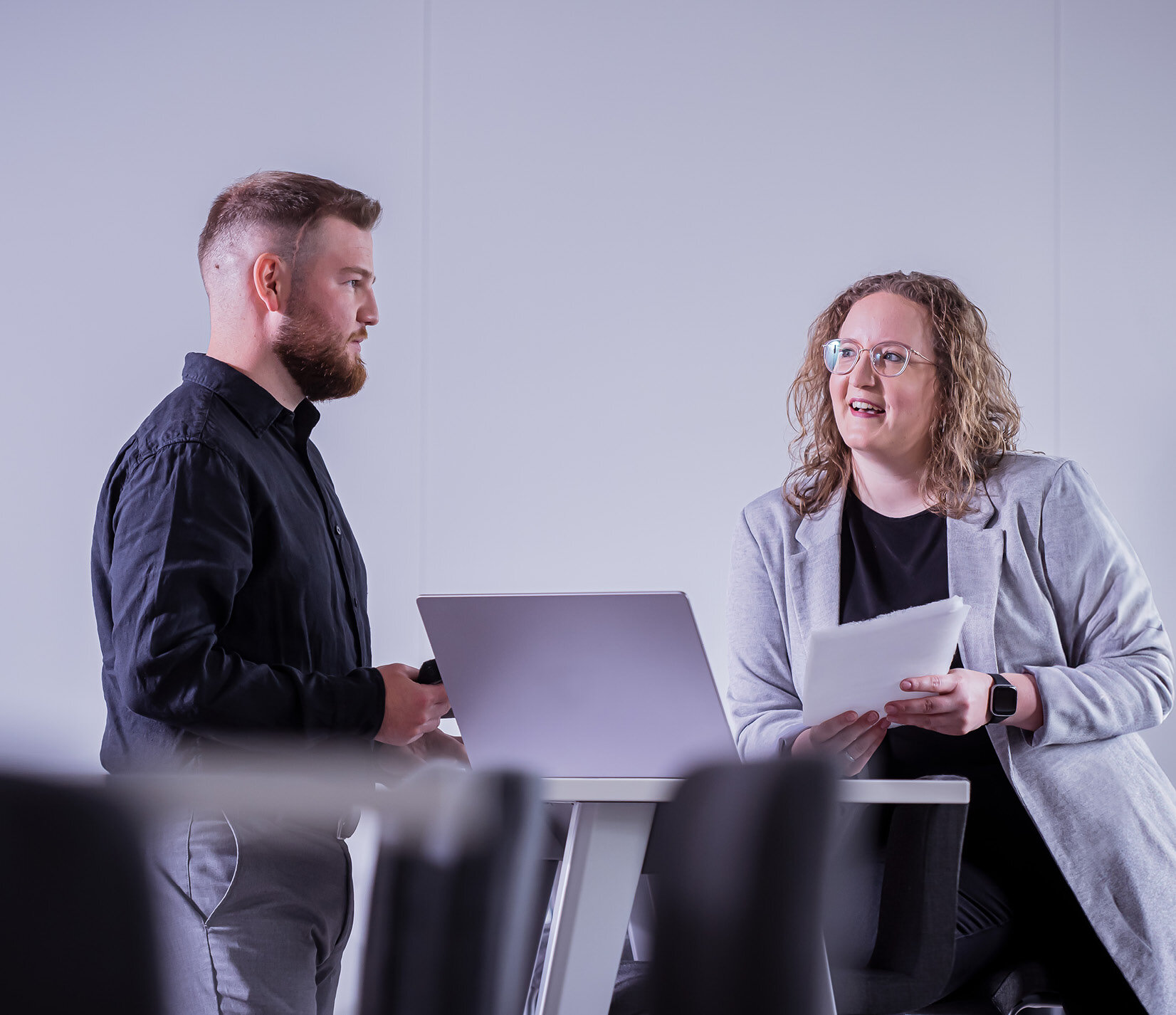 Sandler employees in conversation